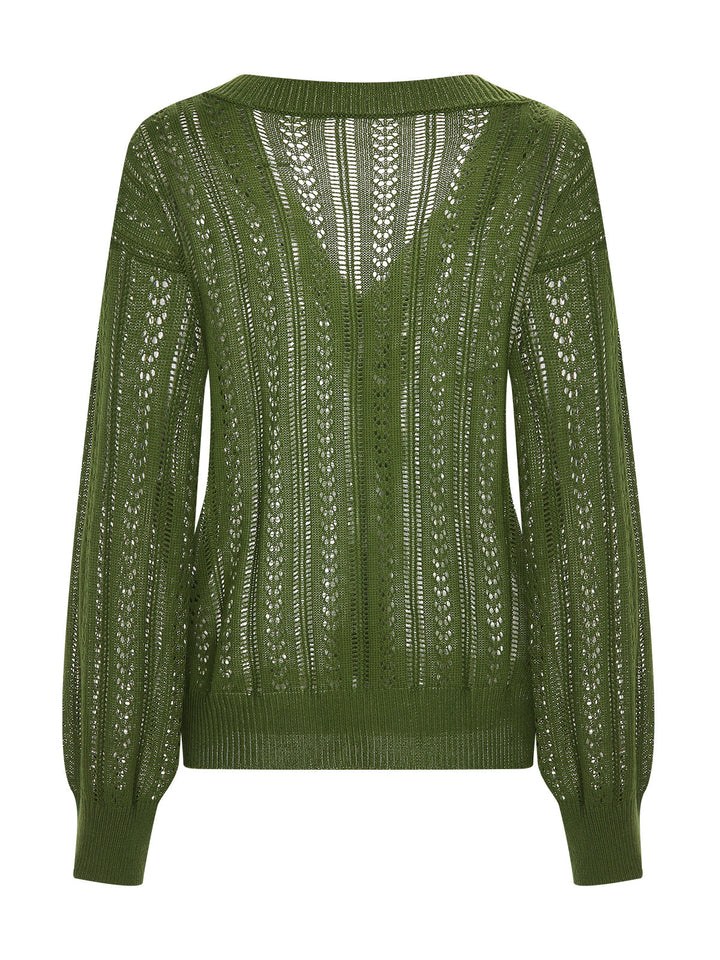 She finds her 1950s story in this 1950s Solid Crochet Hollow Knitted Cardigan