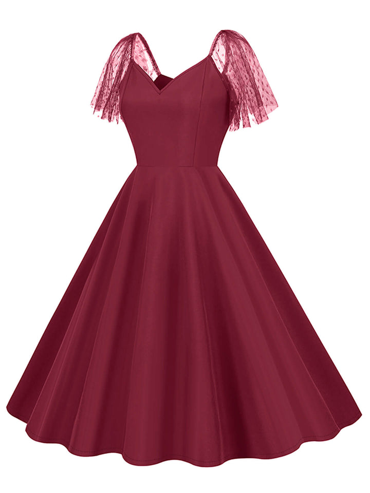 She slips into this 1950s Solid Dots Mesh Sleeve V-Neck Dress and suddenly it&