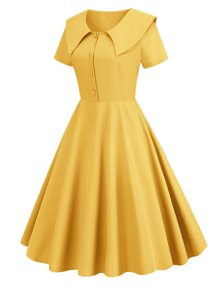 She slips into this 1950s Solid Lapel Swing Dress and suddenly it&