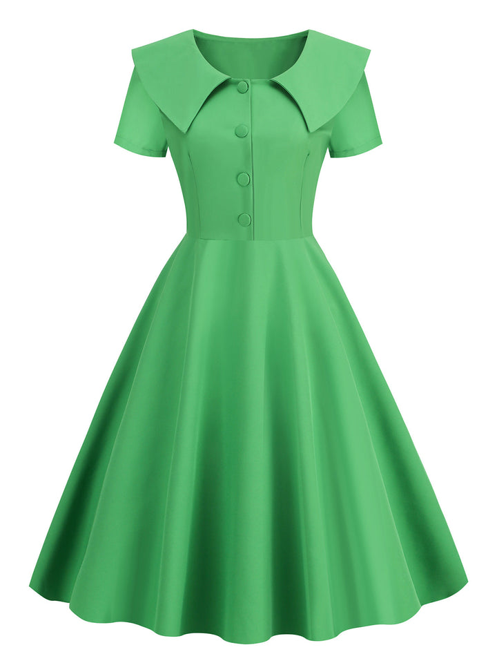 This 1950s Solid Lapel Swing Dress wraps her in 1950s elegance, one twirl at a time