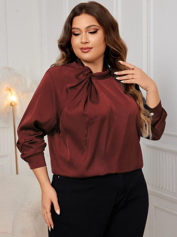 She pairs this 1950s Solid Twist Satin Blouse with confidence and 1950s charm