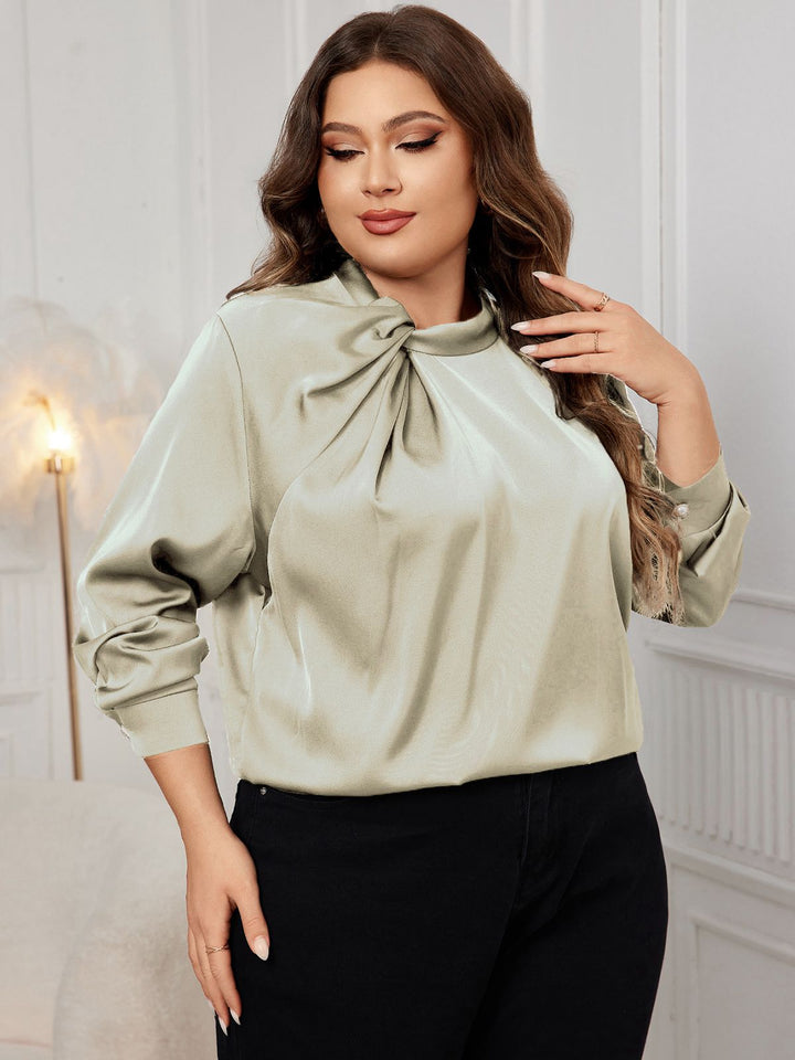 She pairs this 1950s Solid Twist Satin Blouse with confidence and 1950s charm