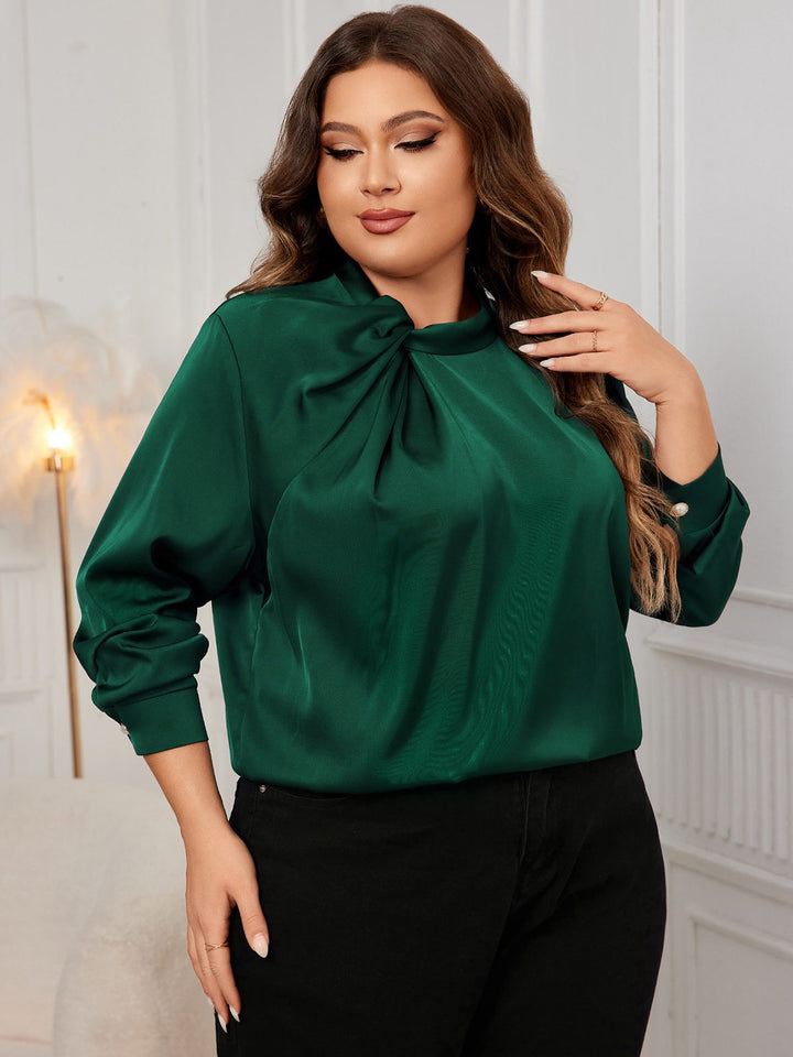 She pairs this 1950s Solid Twist Satin Blouse with confidence and 1950s charm