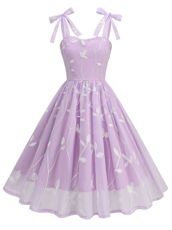 She slips into this 1950s Spaghetti Strap Bow Leaves Mesh Dress and suddenly it&