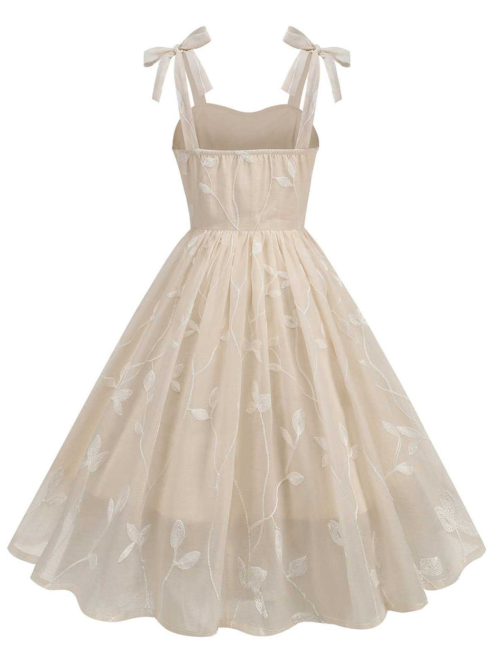 She slips into this 1950s Spaghetti Strap Bow Leaves Mesh Dress and suddenly it&