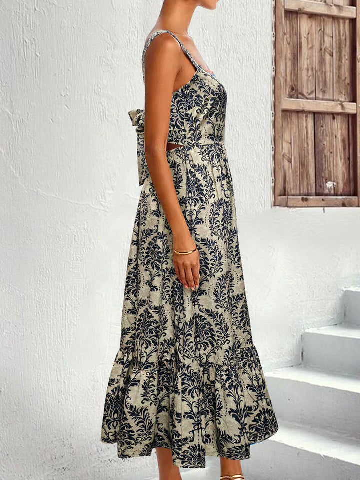 This 1950s Strap Square-Neck Tie-Back Floral Dress wraps her in 1950s elegance, one twirl at a time
