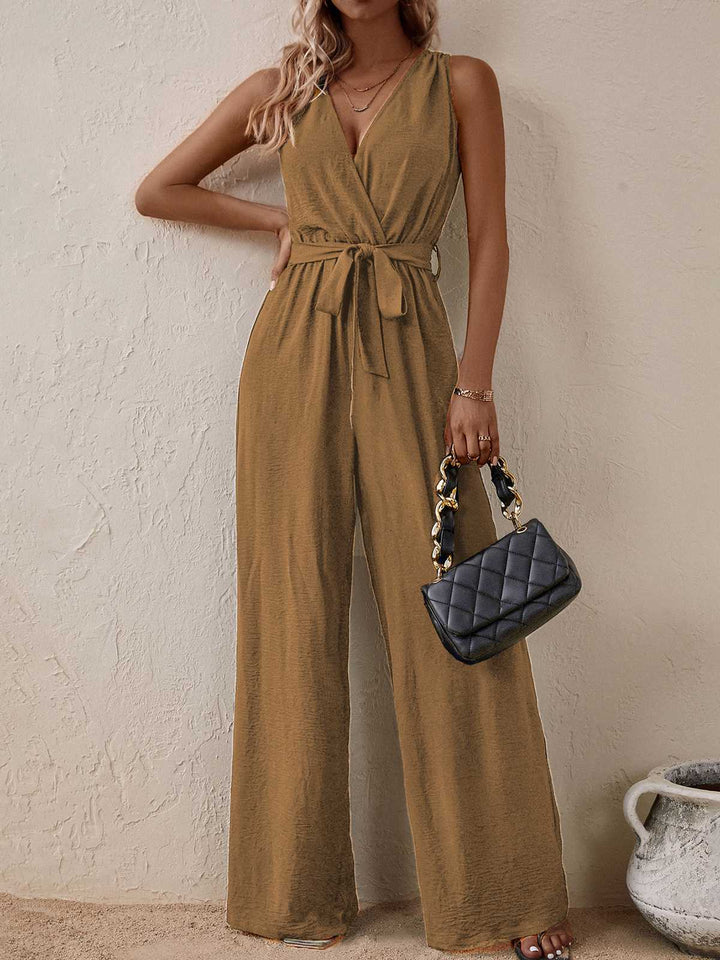She adds this 1950s Surplice V-Neck Solid Belted Jumpsuit and suddenly it&