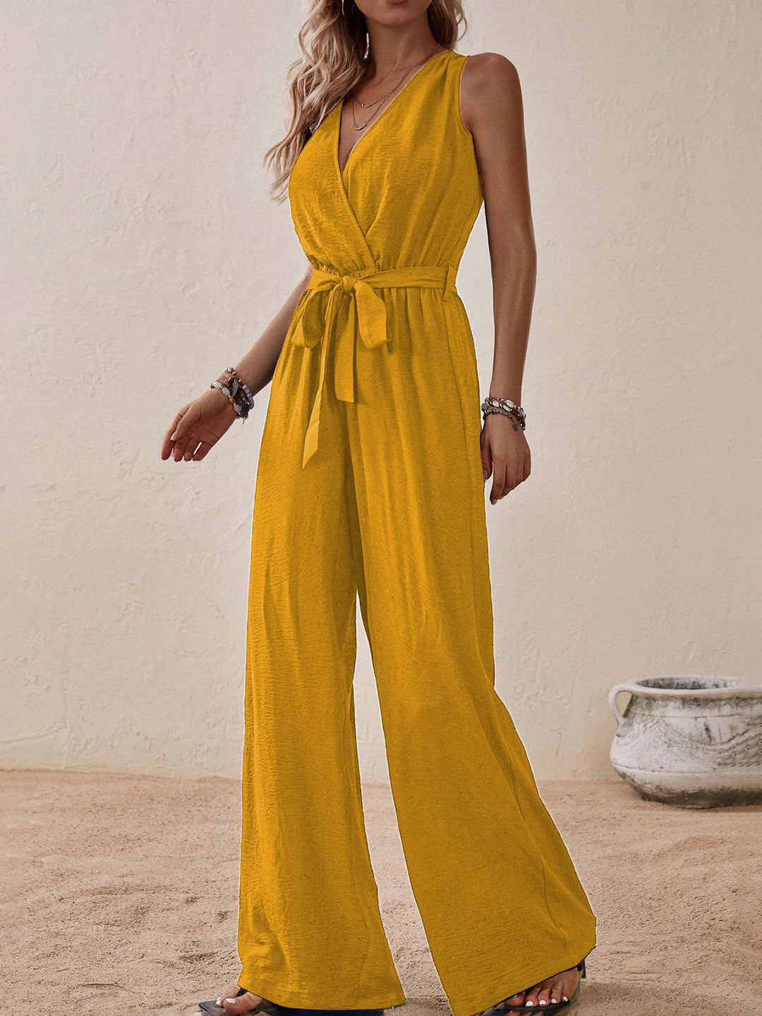 She adds this 1950s Surplice V-Neck Solid Belted Jumpsuit and suddenly it&