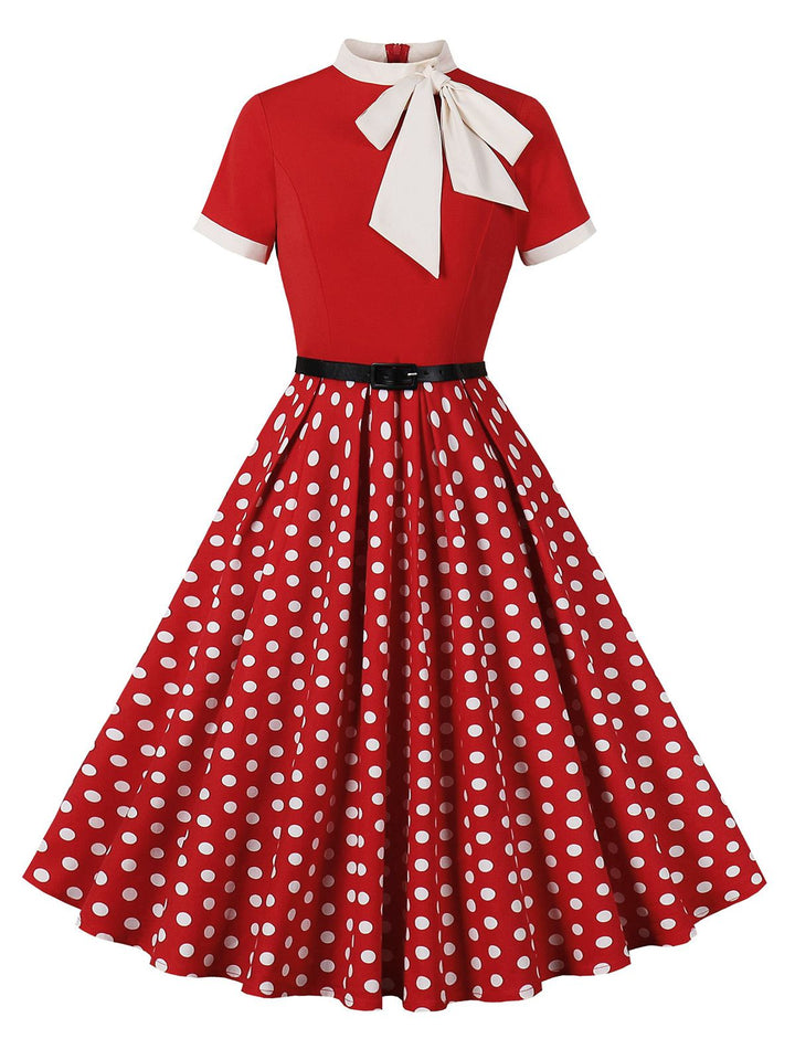 She slips into this 1950s Tie Neck Polka Dots Belted Dress and suddenly it&