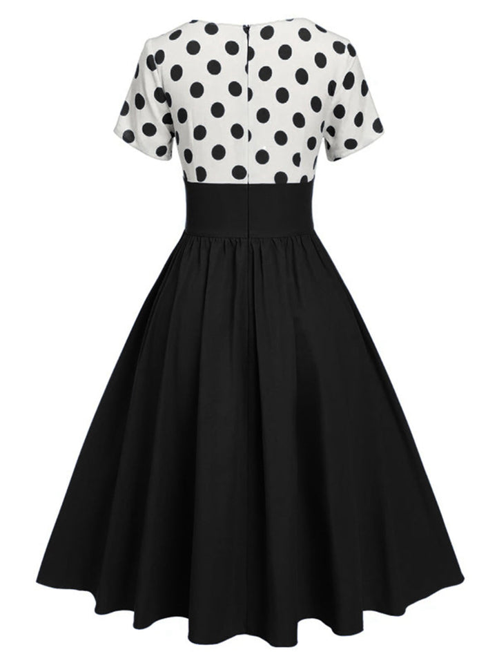 She slips into this 1950s V-Neck Polka Dots Swing Dress and suddenly it&