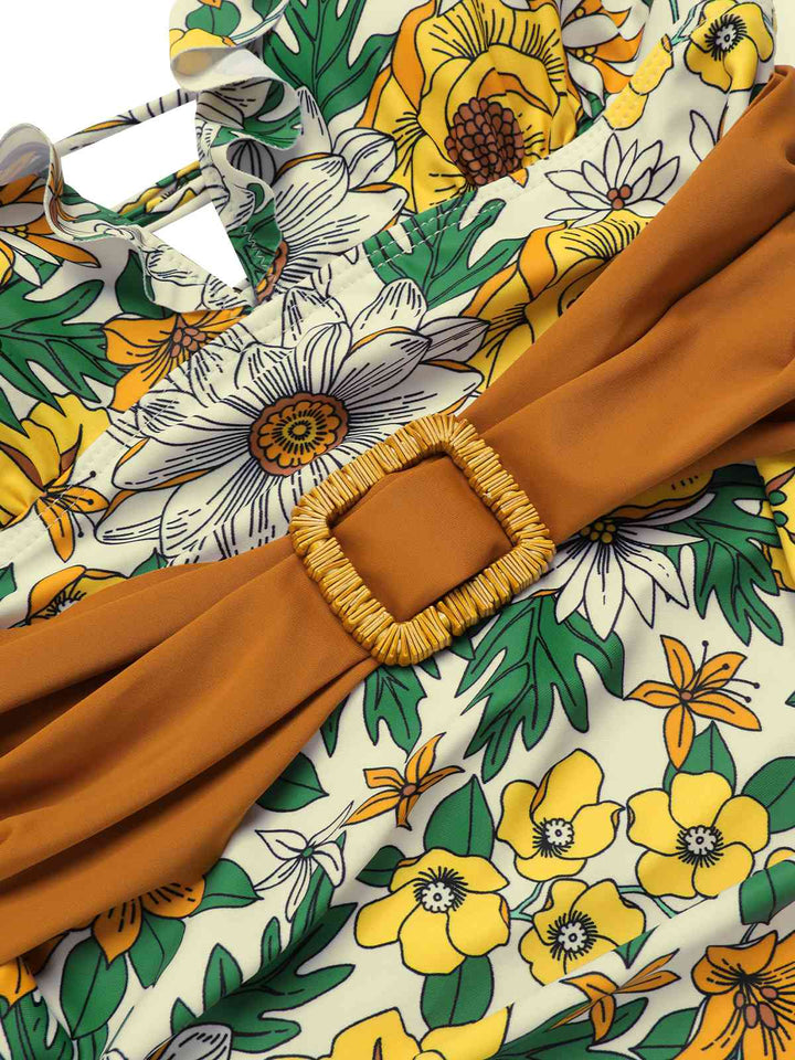This V-Neck Ruffle Shoulder Belted Swimsuit carries vacation dreams in every stitch