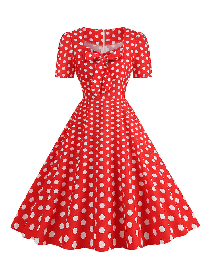She slips into this 1950s Vintage Sweetheart Bow Swing Dress and suddenly it&