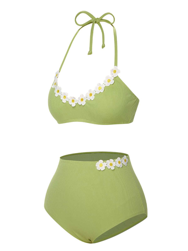 This 1960s Halter Knit Daisy Swimsuit carries 1960s vacation dreams in every stitch
