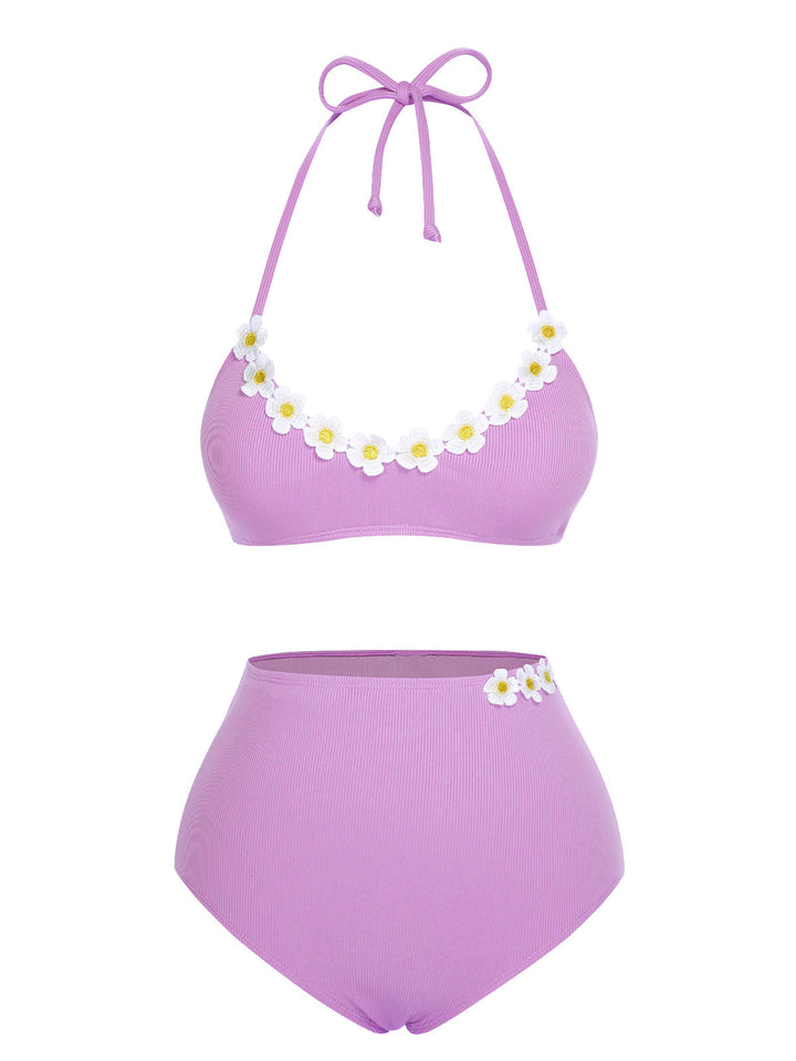 This 1960s Halter Knit Daisy Swimsuit carries 1960s vacation dreams in every stitch