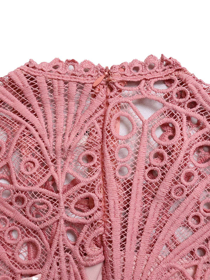 She slips into this 1960s Solid Lace Crochet Pleated Belted Dress and suddenly it&