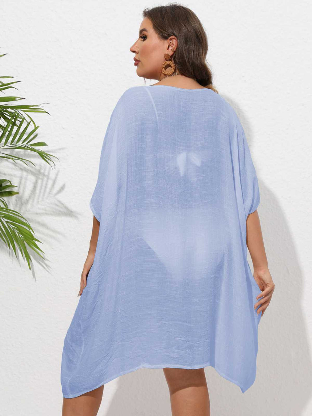 This Solid Patchwork Loose Cover-Up whispers secrets to those who notice