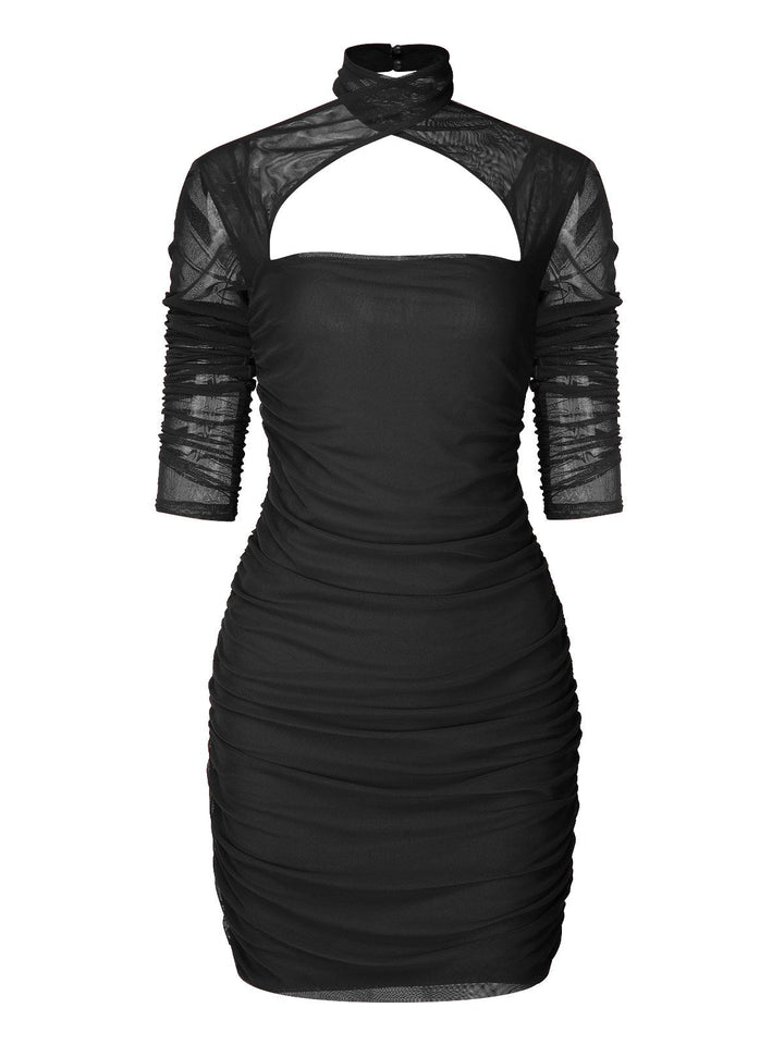 She slips into this 1960s Solid Sheer Wrinkle Halter Bodycon Dress and suddenly it&