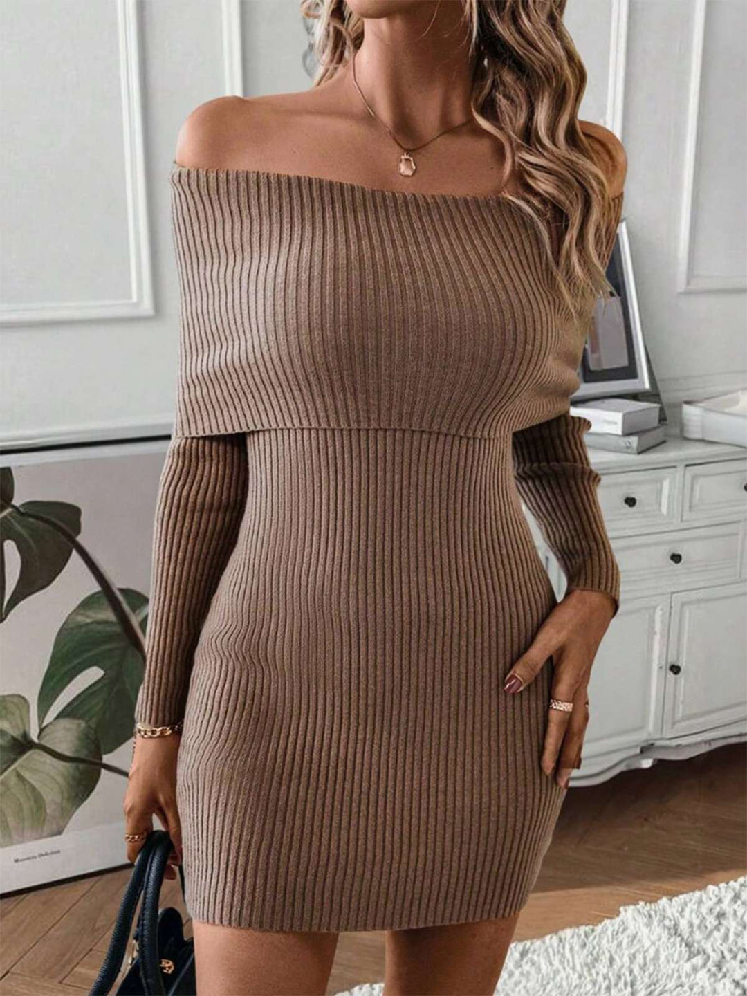 She slips into this 1970s Solid Off-Shoulder Ribbed Knit Dress and suddenly it&