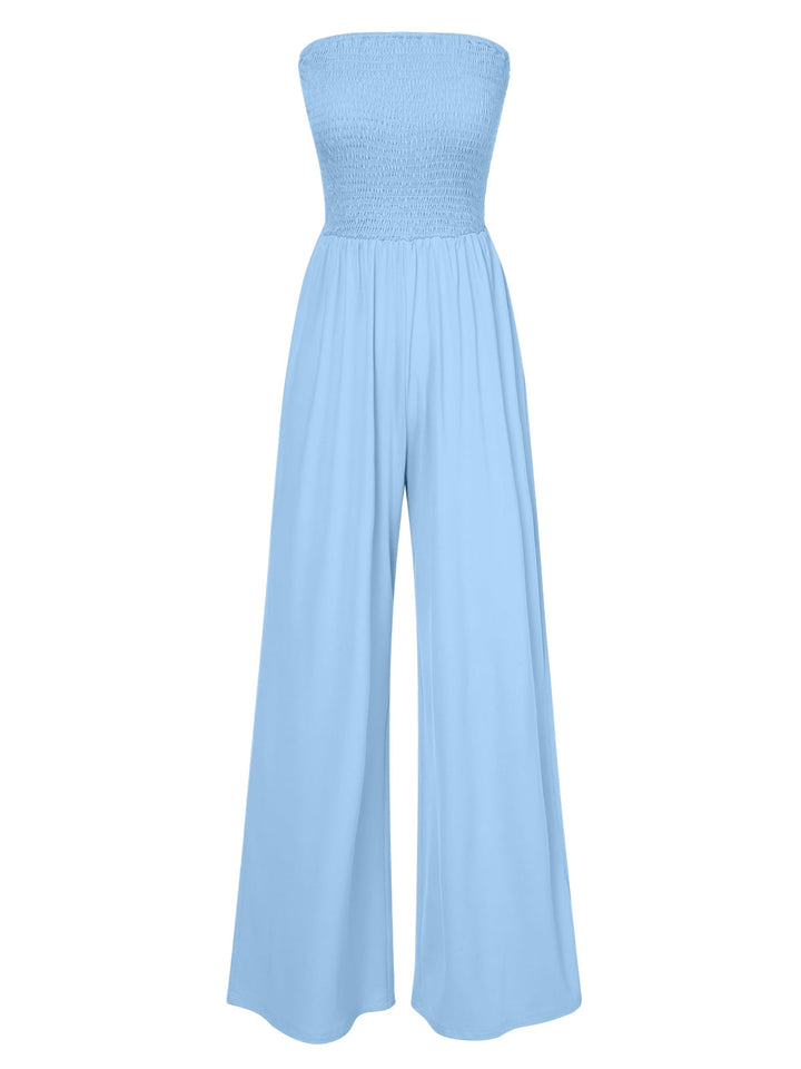 She finds her 1970s story in this 1970s Solid Sleeveless Smocked Bandeau Jumpsuit