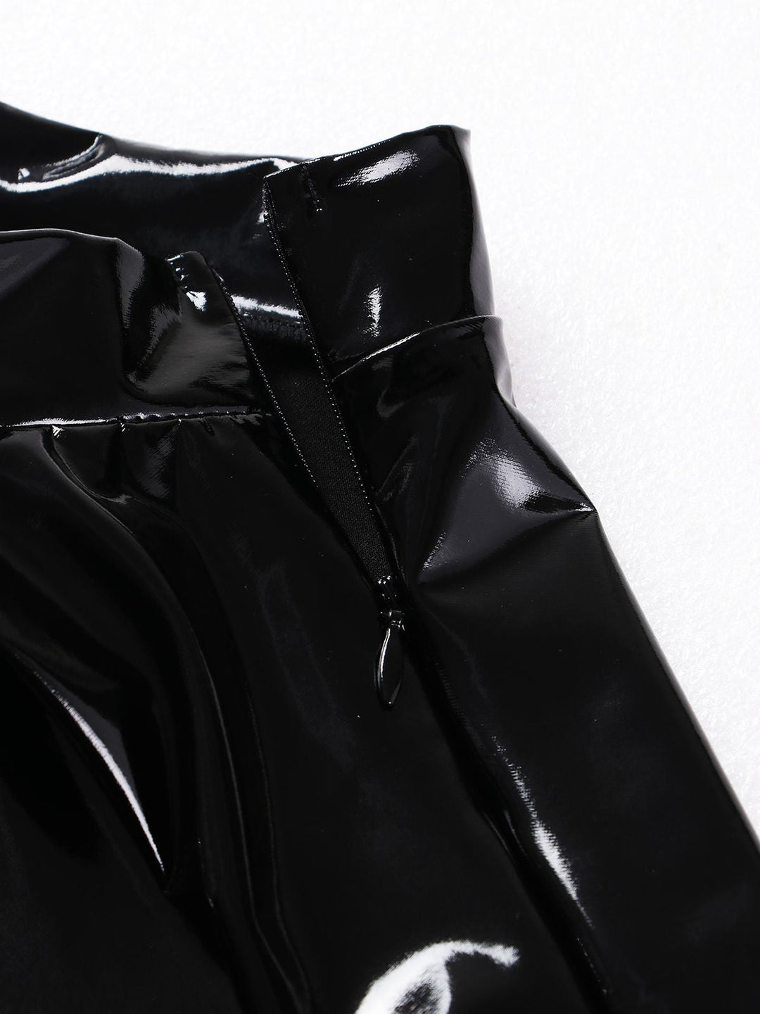 She sways in this 1980s Patent Leather Pleated Mini Skirt and it&