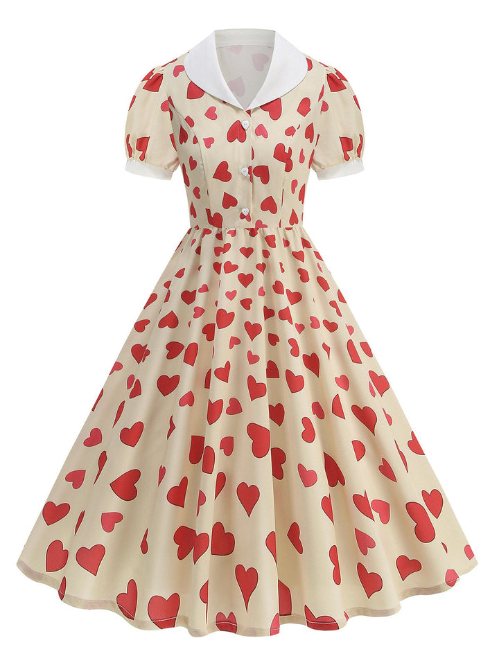 She slips into this Beige 1950s Hearts Puff Sleeves Lapel Dress and suddenly it&