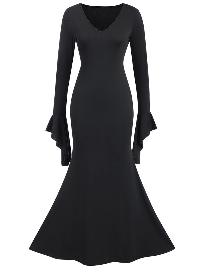 She slips into this Black 1930s Sold Batwing Cuffs Fishtail Dress and suddenly it&