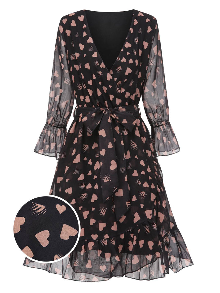 She slips into this Black 1940s Heart Sheer Sleeves Wrap Dress and suddenly it&