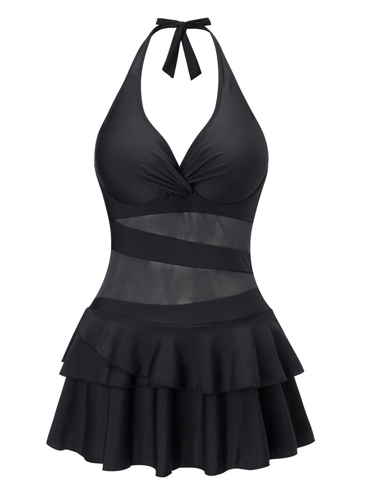 She slips into this Black 1940s Layered Hem Halter Swimdress and suddenly it&