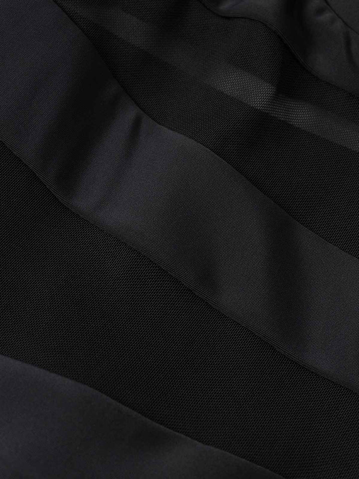 This Black 1940s Layered Hem Halter Swimdress wraps her in 1940s elegance, one twirl at a time