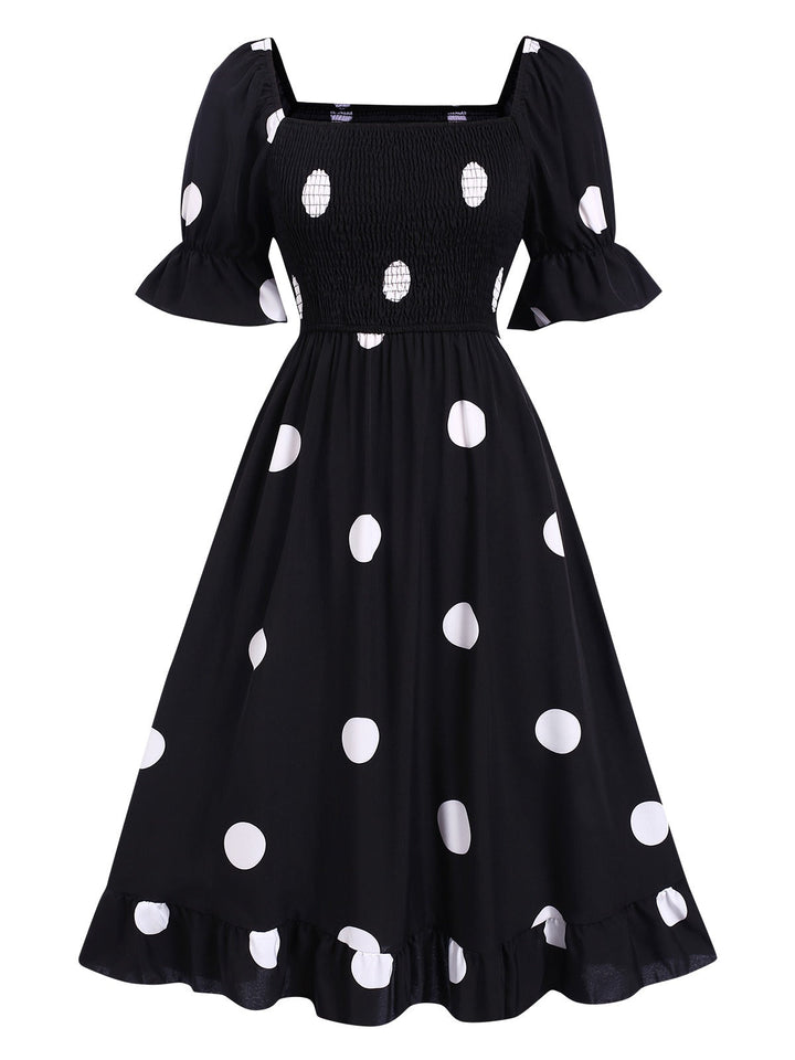She slips into this Black 1940s Ruffle Cuffs Polka Dots Smocked Dress and suddenly it&