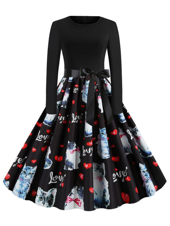 She slips into this Black 1950s Cat Heart Belted Dress and suddenly it&