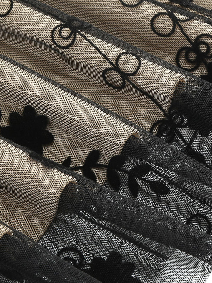 This Black 1950s Floral Mesh Patchwork Dress wraps her in 1950s elegance, one twirl at a time
