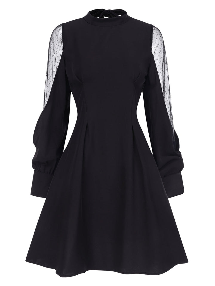 She slips into this Black 1950s Illusion Patchwork Sleeves Dress and suddenly it&