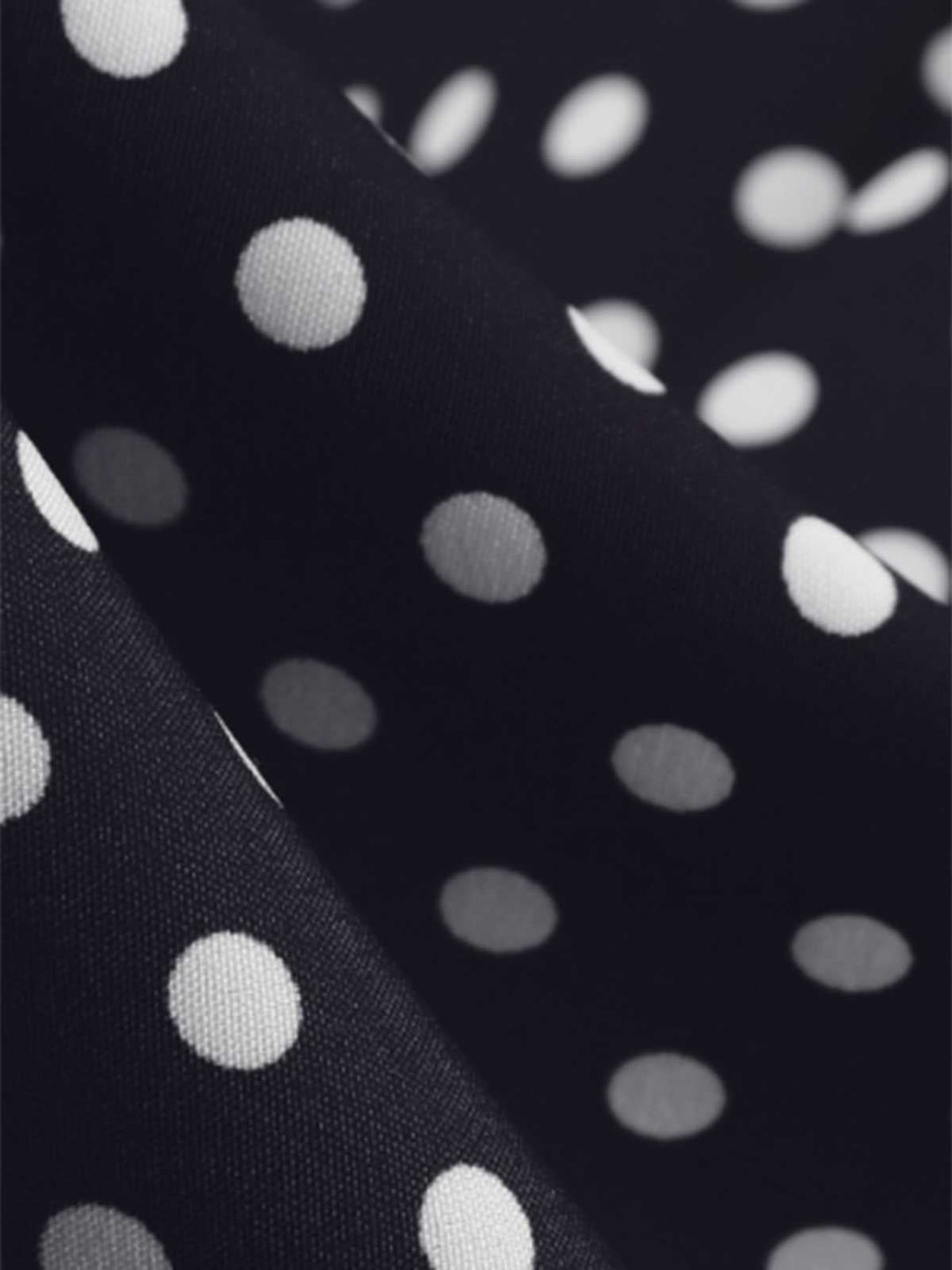 Black 1950s Polka Dots Ruffles Dress — the kind of 1950s dress that makes strangers smile