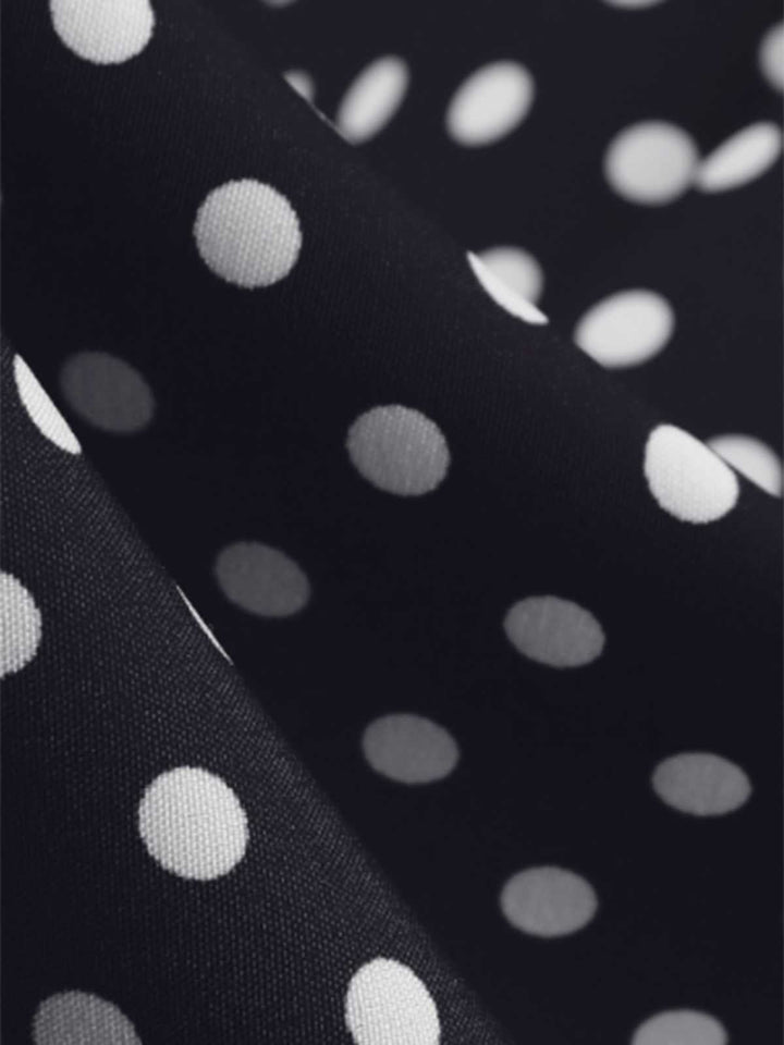 Black 1950s Polka Dots Ruffles Dress — the kind of 1950s dress that makes strangers smile