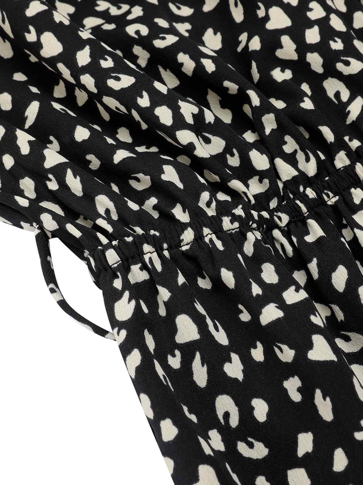 Black 1950s Printed V-Neck Belted Romper: timeless style reimagined