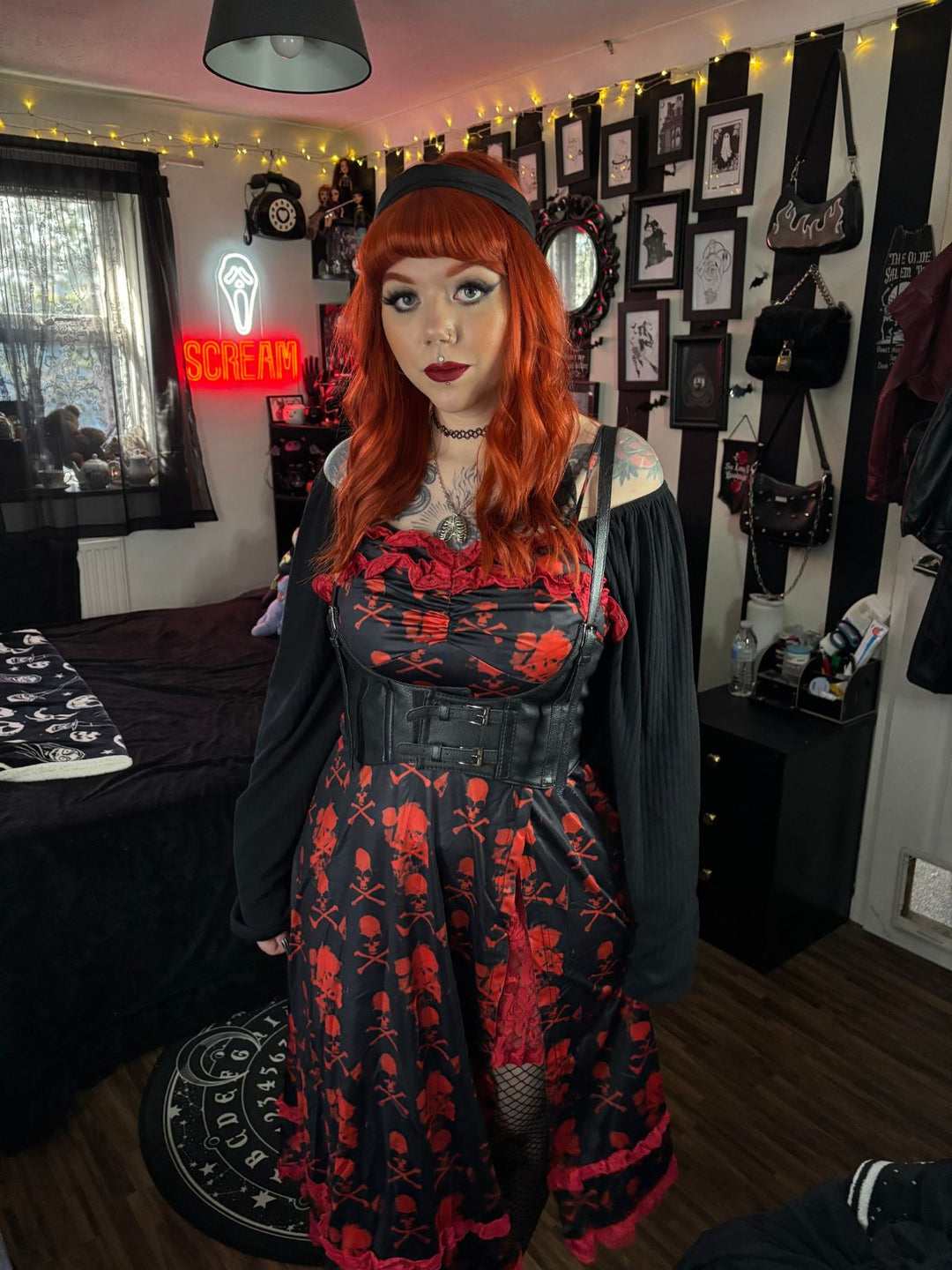 She slips into this Black 1950s Skull Lace Strap Dress and suddenly it&