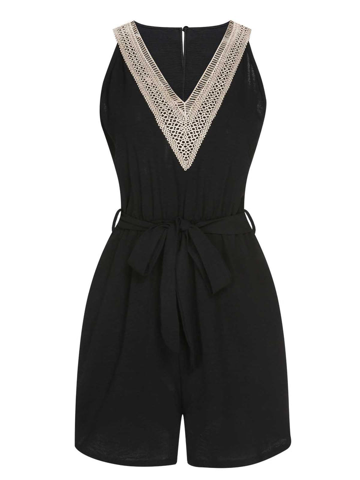 She adds this Black 1960s V-Neck Belted Romper and suddenly it&