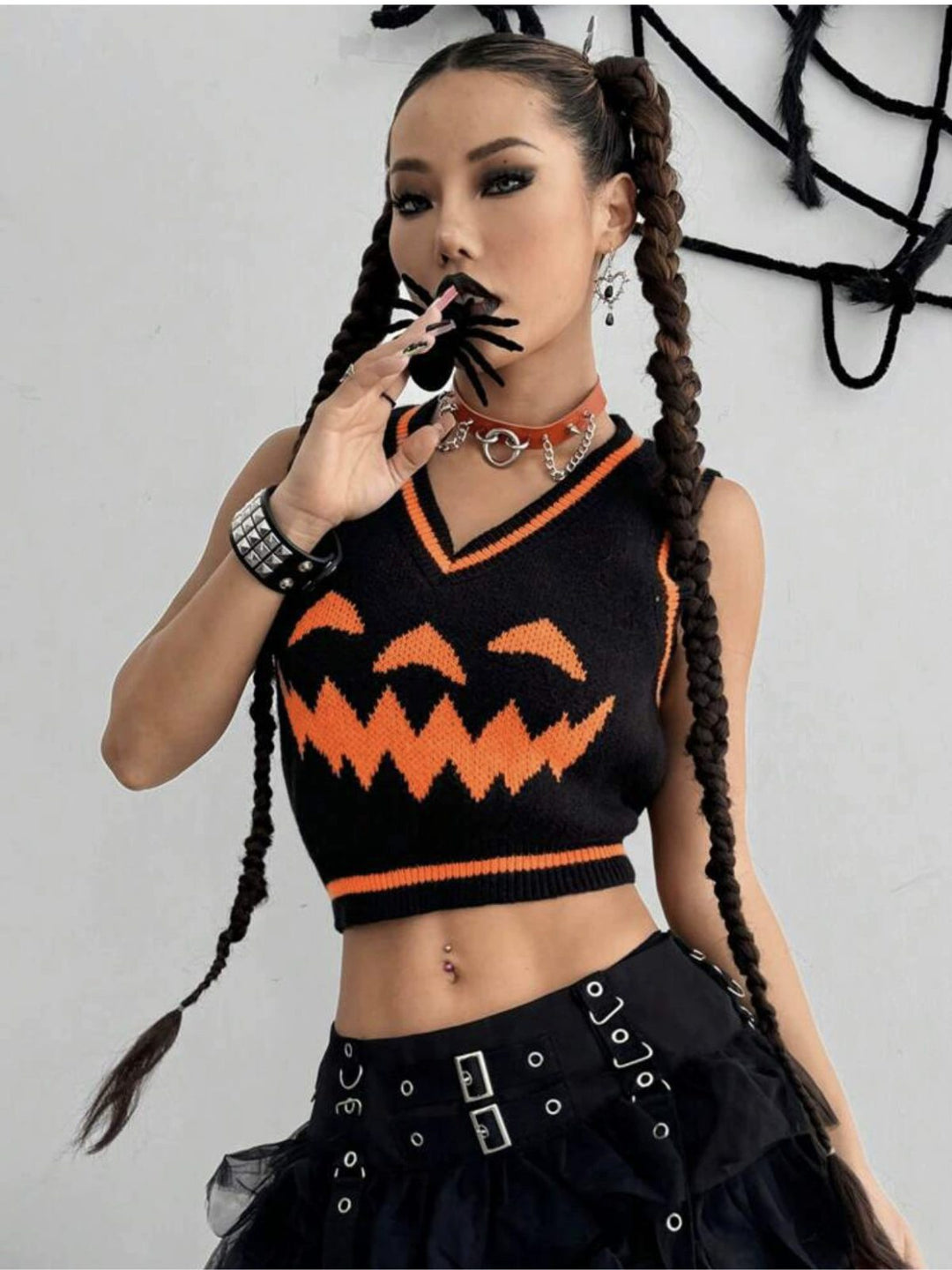 Black 1970s Halloween Pumpkin Face Sweater Vest, vintage fashion, retro style - perfect for women who love vintage and retro fashion