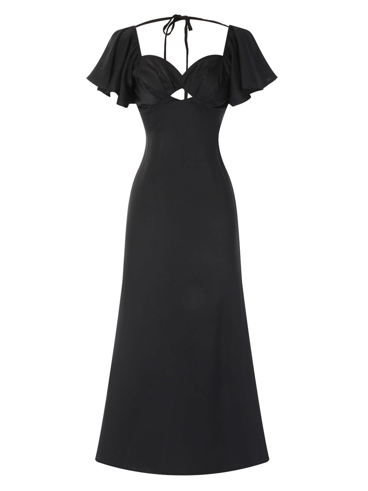She slips into this Black 1970s Hollow Sweetheart Neck Dress and suddenly it&