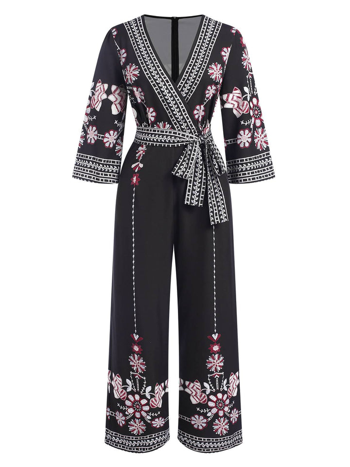 She finds her 1970s story in this Black 1970s Surplice V-Neck Floral Jumpsuit