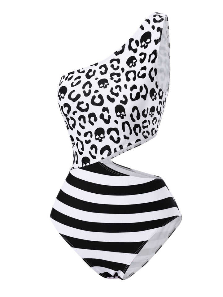 This Black 1980s One-Shoulder Hollow Skull Stripe Swimsuit carries 1980s vacation dreams in every stitch