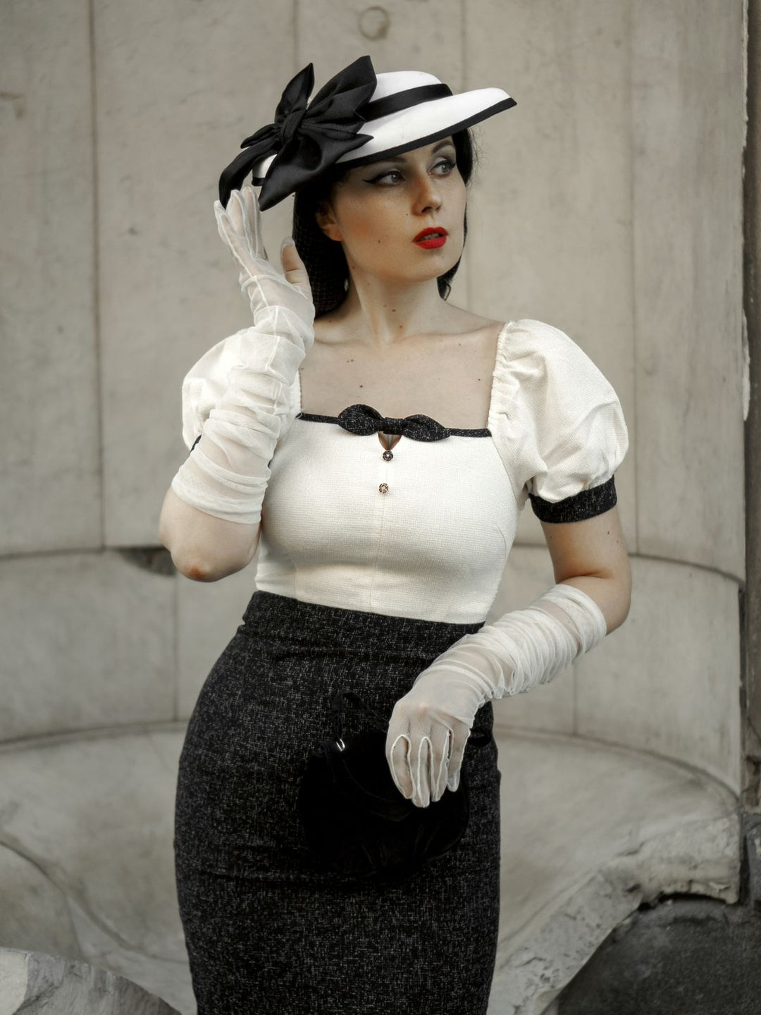 She slips into this Black &amp; Beige 1960s Puff Sleeve Pencil Dress and suddenly it&