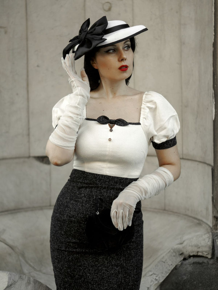 She slips into this Black &amp; Beige 1960s Puff Sleeve Pencil Dress and suddenly it&