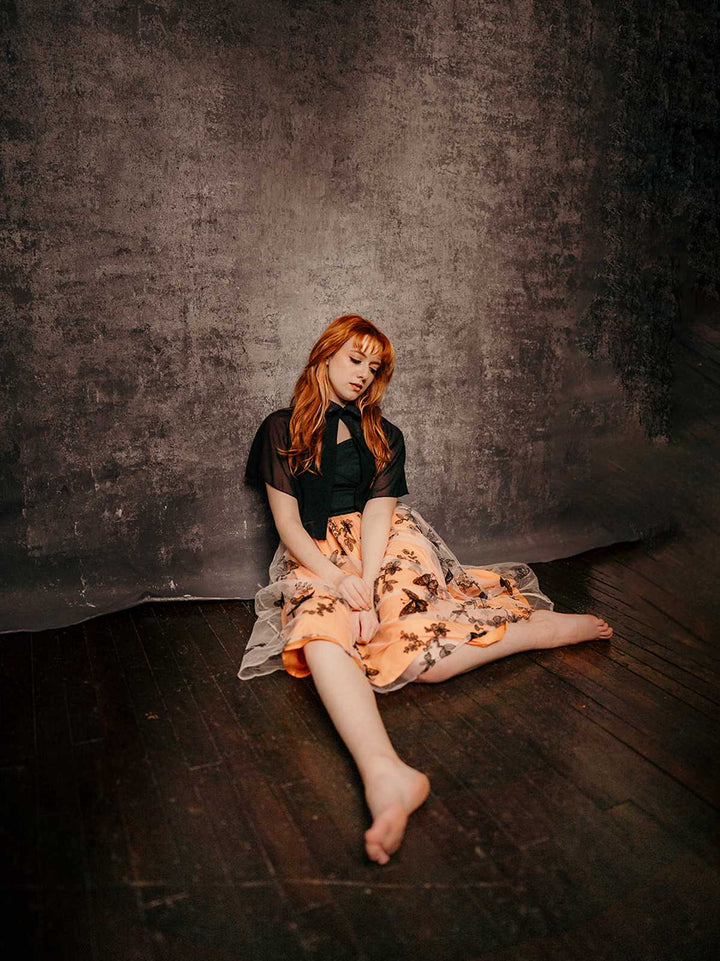 She slips into this Black &amp; Orange 1950s 3D Butterfly Cloak Dress and suddenly it&