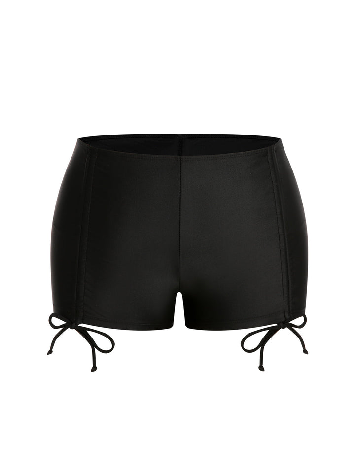 Black &amp; White 1960s Geometric Lace-Up Swimsuit — because 1960s glamour never goes out of style