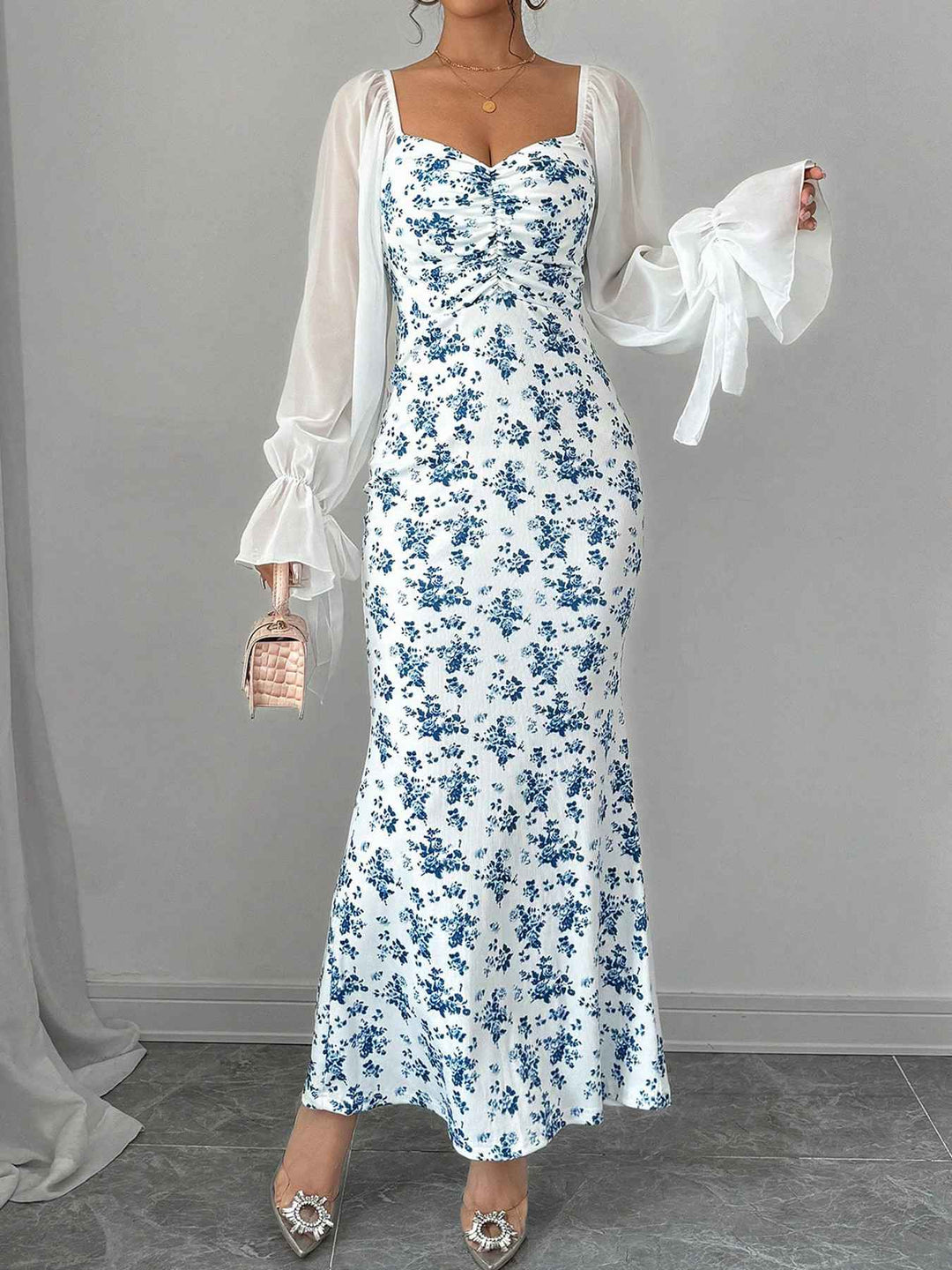 She slips into this Blue 1930s Chiffon Sleeves Ditsy Floral Dress and suddenly it&