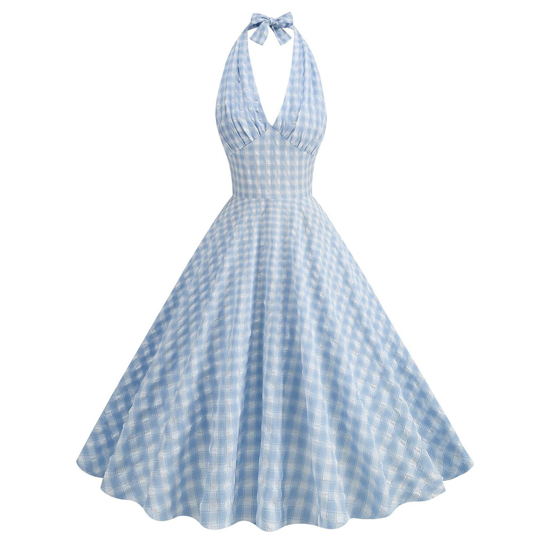 She slips into this Blue 1950s Halter Plaid Swing Dress and suddenly it&