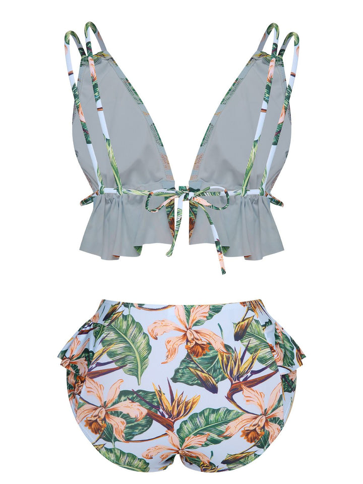 This Blue 1960s Plants Back Tie Ruffles Swimsuit carries 1960s vacation dreams in every stitch