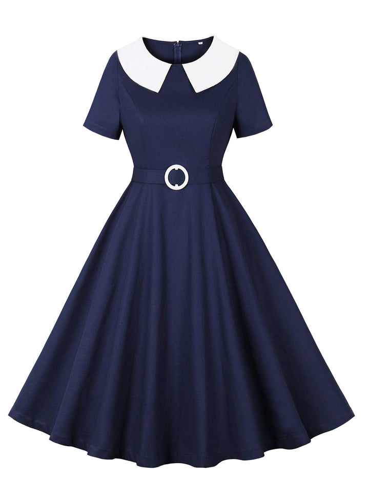 She slips into this Dark Blue 1950s Peter Pan Collar Solid Dress and suddenly it&